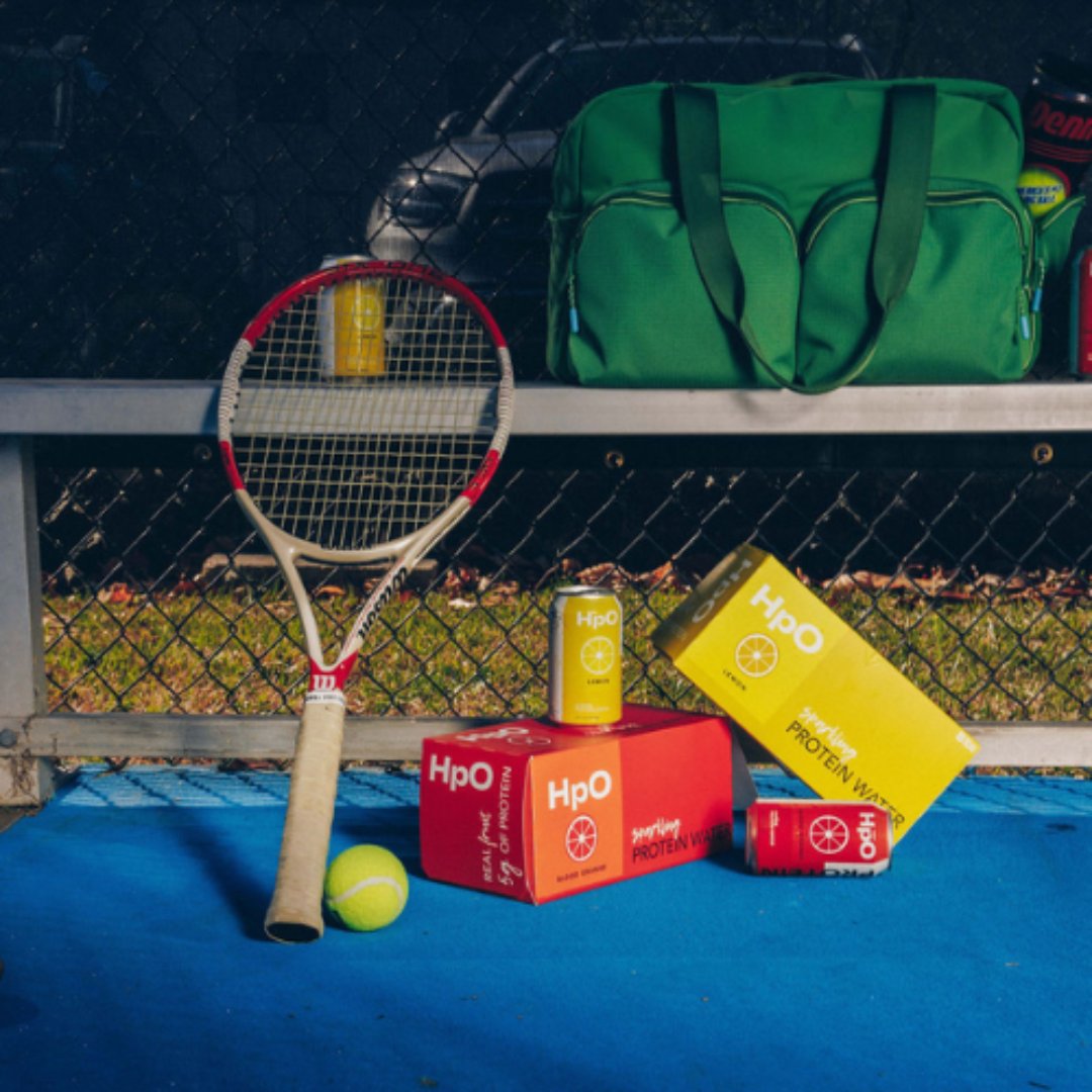 HpO cases and cans at tennis court