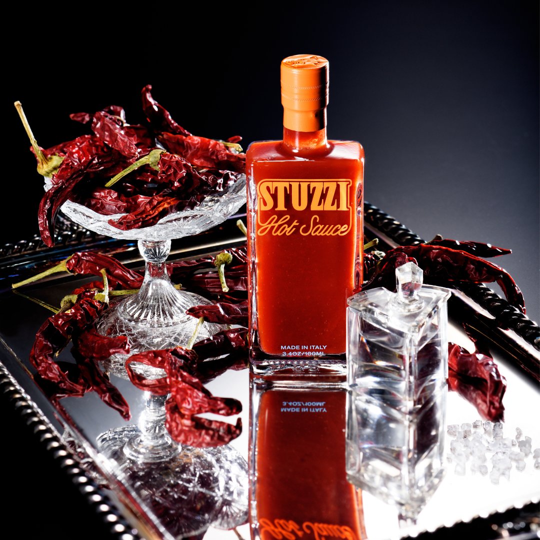 Stuzzi bottle on mirror tray